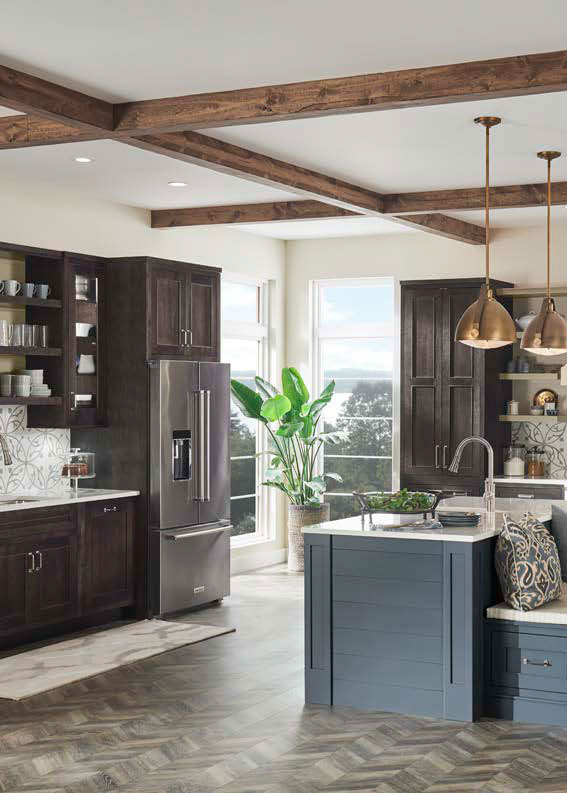 Kitchen with dark wood cabinets, blue island, quartz countertops, and exposed ceiling beams