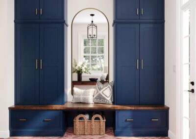 Blue mudroom with built-in bench, storage cubbies, and coat hooks.