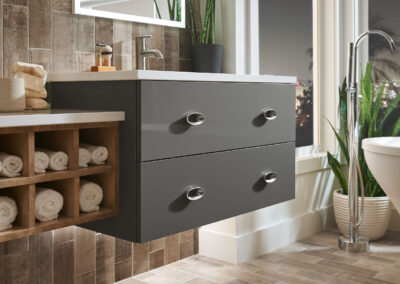 Gray floating bathroom vanity with custom towel shelving unit.