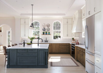 Kitchen with white perimeter cabinets, blue island, white countertops, and stainless steel appliances.