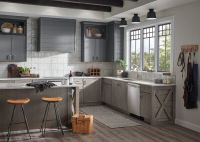 Kitchen with light gray cabinets, white countertops, stainless steel appliances, and a farmhouse sink.